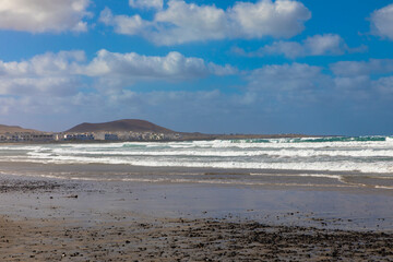 Famous village Caleta Famara and the surfers beach in the Chinijo Natural Park near the village Teguise. Lanzarote, Spain, Europe