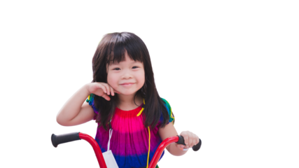 Cheerful Child on a Red Tricycle. A smiling young girl with bangs enjoying her ride on a bright red tricycle, isolated background. Asian Kid aged 3 years old.