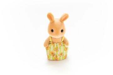 Animal doll isolated on white background. Miniature dollhouse toy. Kids toy. Animal character. Play and learn. Kids room. Childhood. Kindergarten toy. Developmental toys. Bunny toys. Easter bunny.