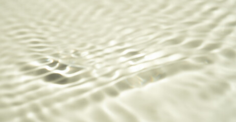 Summer sea natural background Beige surface, clear water with ripples and splashes. water waves in sunlight The water surface has waves.	
