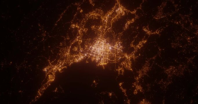 Hiroshima (Japan) aerial view at night. Top view on modern city with glow effect. Camera is zooming out, rotating counterclockwise