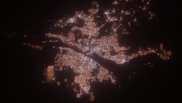 Khartoum and Omdurman (Sudan) top view at night. Top view on modern city with street lights and glow effect. Camera is zooming in, rotating clockwise. Vertical video. The north is on the left side