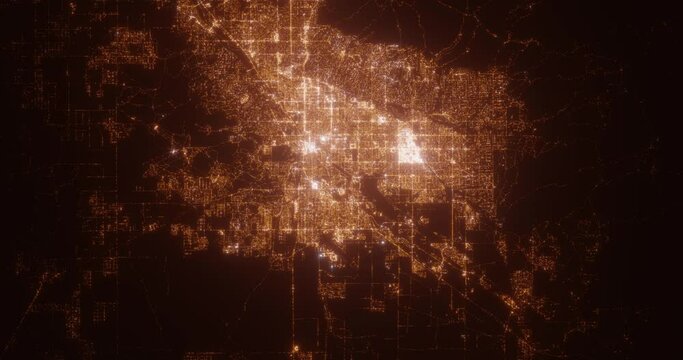 Tucson (Arizona, USA) aerial view at night. Satellite view on modern city with street lights. Camera is flying above the city, moving forward