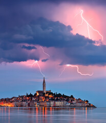 Lightning and storm clouds over the city of Ravinj on the Istrian Peninsula in Croatia. The town is...