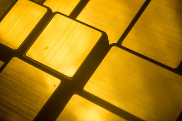 Golden metal elements against a radiant background