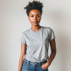 Grey T-shirt Mockup, Black Woman, Girl, Female, Model, Wearing a Grey Tee Shirt and Blue Jeans, Blank Shirt Template, White Background, Close-up View