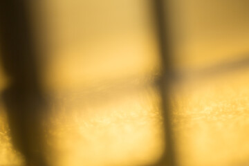 Golden metal elements against a radiant background