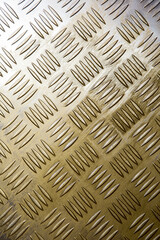 Golden metal elements against a radiant background