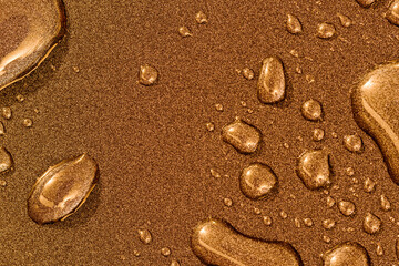 Fototapeta na wymiar Abstract background with water drops on a copper surface
