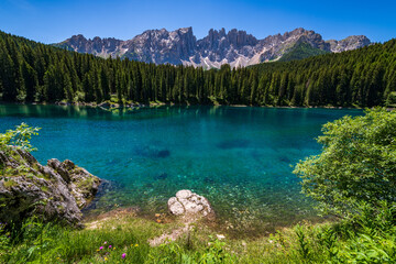 Karersee lake in the Dolomites, South Tyrol, Italy, also known as lake Carezza - 720061614