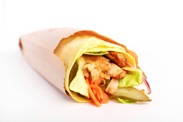 shawarma and salad on a black background. Cut and filling. Meat and salad. Eastern cuisine. shawarma on a white background. Hand in frame. minimalism. Top view. Flatlay.
