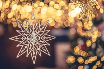 Christmas background with decorative star with bokeh lights.