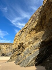 sandstone rock in the blue sky background, ocean rocky coast
