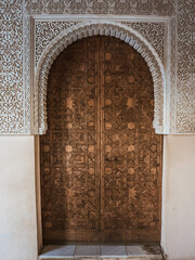 Detail of a wooden door and ornament of Alhambra, Granada, Spain