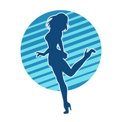 Silhouette of a female dancer wearing mini skirt in action pose. Silhouette of a slim woman dancing happily.