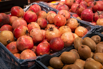 Pomegranate garnet fruit at a pile on a market.