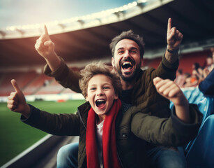 father and son cheer football team at grandstand..cheer for their favorite team at a sports match, football, competition, stadium, arena