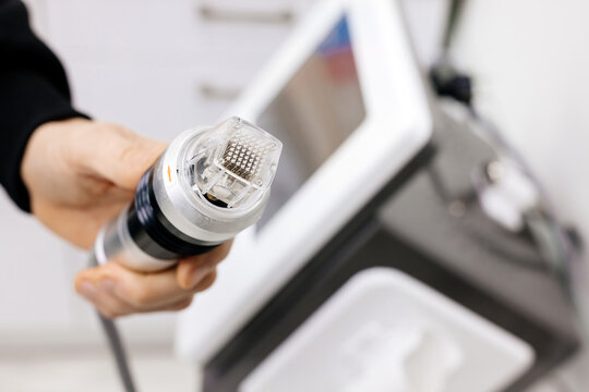 Cosmetology medical device for radiofrequency lifting procedure for face skin rejuvenation and anti-age at aesthetic cosmetology center. RF lifting in beauty clinic.