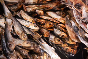 Background of smoked fish on a supermarket display.