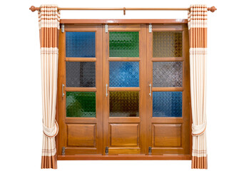 Colorful stained glass window with cream-colored curtains isolated