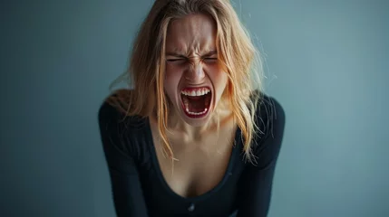 Fotobehang The young emotional angry woman screaming © Eman Suardi
