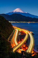 Aerial view of Mountain fuji with long exposure car light trails at the Satta Pass viewpoint,...