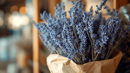 Fotobehang Bouquet of dried lavender in kraft paper © Misha