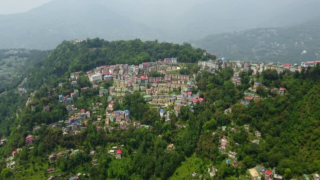 Aerial view of the cloudy day in gangtok city capital of sikkim state.A cable car riding towards station at the town center of gangtok, sikkim.