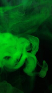 vertical green smoke dark background