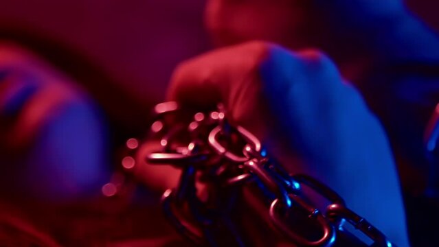 Sexual arousal excitement abstinence concept. BDSM fetish. Passion desire temptation. Lust. Tied up girl holding chains by hands. Hot mistress. Intimate adult games, punishment. Female pervert slave