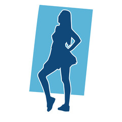 Silhouette of a female dancer wearing mini skirt in action pose. Silhouette of a slim woman dancing happily.