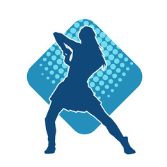 Silhouette of a female dancer wearing mini skirt in action pose. Silhouette of a slim woman dancing happily.