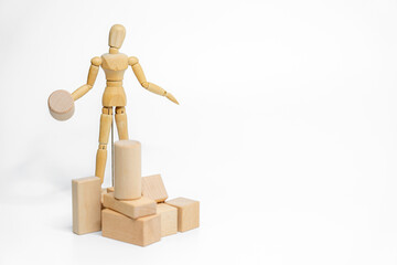 Wooden doll with wooden toy block isolated on white background. business or creative concept