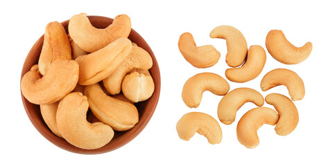 Roasted Cashew nuts in wooden bowl isolated on white background with full depth of field. Top view. Flat lay