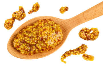 french mustard in wooden spoon isolated on white background with full depth of field. Top view....
