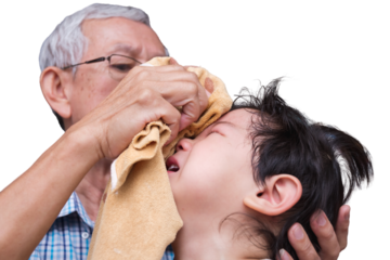 Elderly Man Wiping Tears from Child's Face, Senior man gently wipes away tears from young Asian child's face, offering comfort and solace, expressing familial love and care, isolated background.