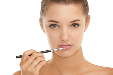 Makeup, brush and portrait of woman with lipstick application in studio for cosmetics on white...