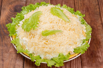 Chicken meat salad with canned pineapple and corn on lettuce