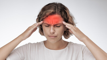 Hands on the head, headache because of a stress, or other. Suffering girl of migraine. High quality studio banner photo