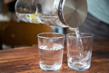 Water glass, water, holding a water glass
