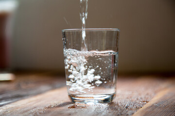 Water glass, water, holding a water glass