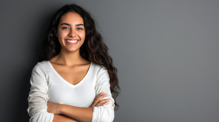 Fototapeta premium A woman wearing a happy expression, crossing her arms on copyspace background