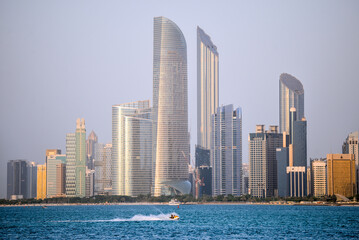 Fototapeta premium Skyline of abudhabi from corniche during the sunset
