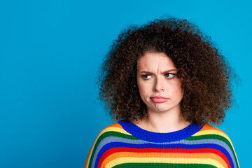 Photo portrait of attractive young woman unhappy look empty space dressed stylish rainbow print...