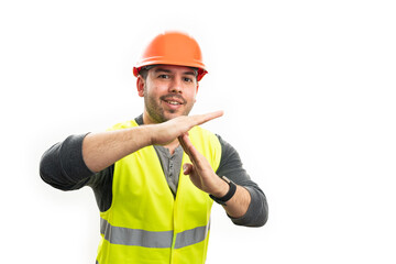 Constructor man making timeout gesture with friendly expression