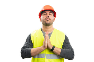 Builder holding hands as prayer gesture faithful concept