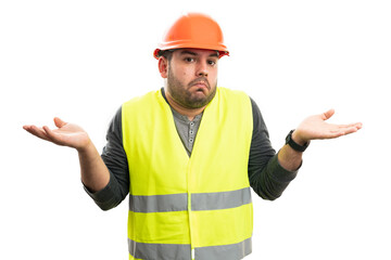Confused constructor man making clueless gesture with palms