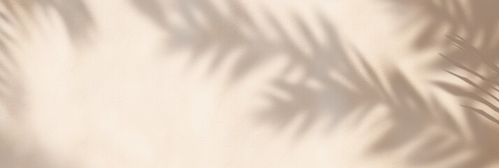 Beautiful texture of beige brown luxury, smooth stucco wall with soft foliage dappled light of tropical tree leaf shadow	

