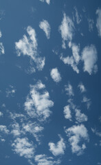 Blue sky with white clouds, natural backgrounds, vertical banner