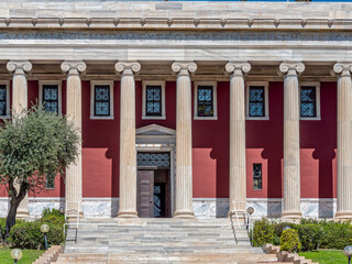 Fototapeta premium Partial view of the columns of Gennadius Library facade. .On the front is written a quote of Isocrates: 
